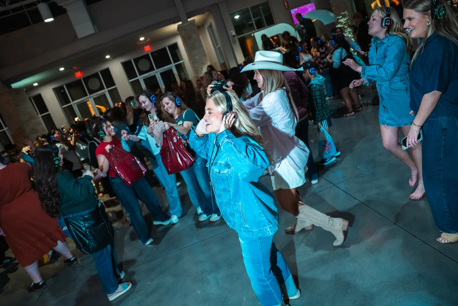 Mid-dance in the church lobby — cowboy hat and all