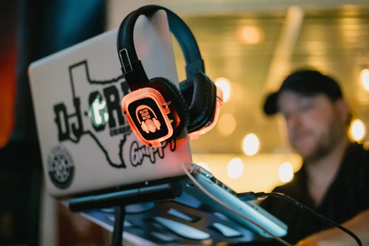 Professional DJ running a live set on the headphone system