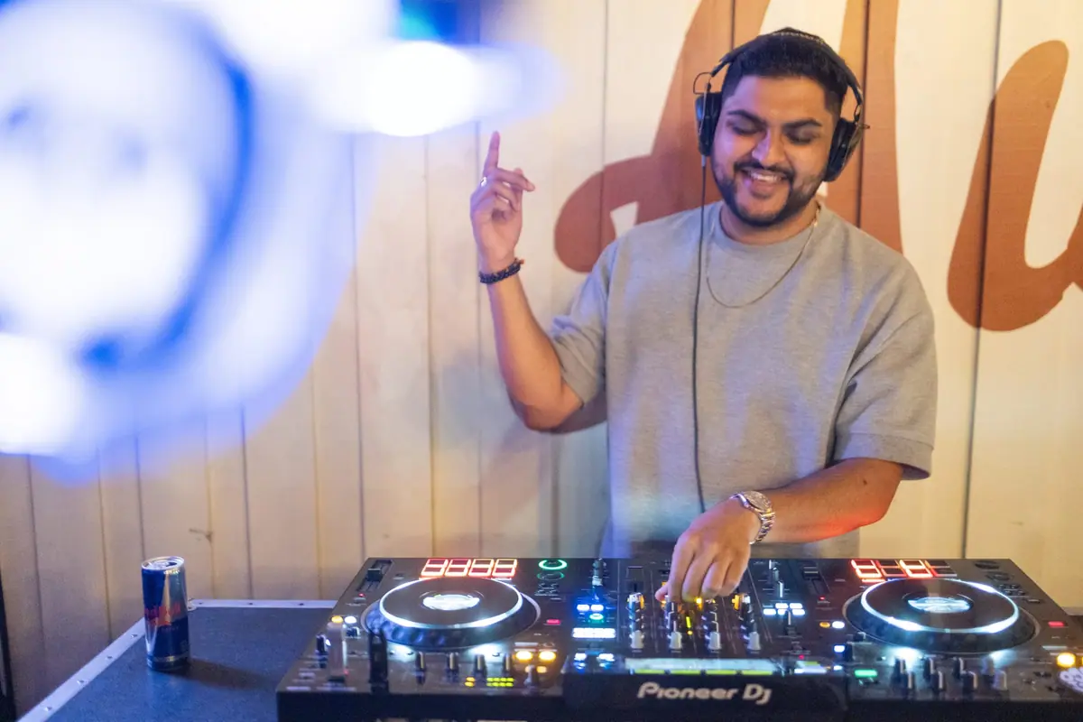 Professional DJ running a live set on the headphone system